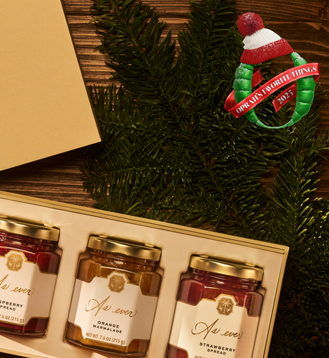 Three jars of As ever spreads in a gift box with a Christmas tree and ornament in the background
